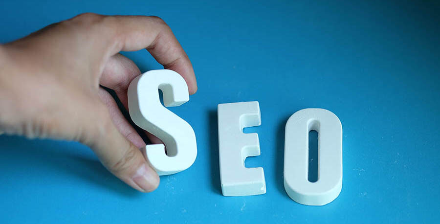 Hand arrange white letters as SEO